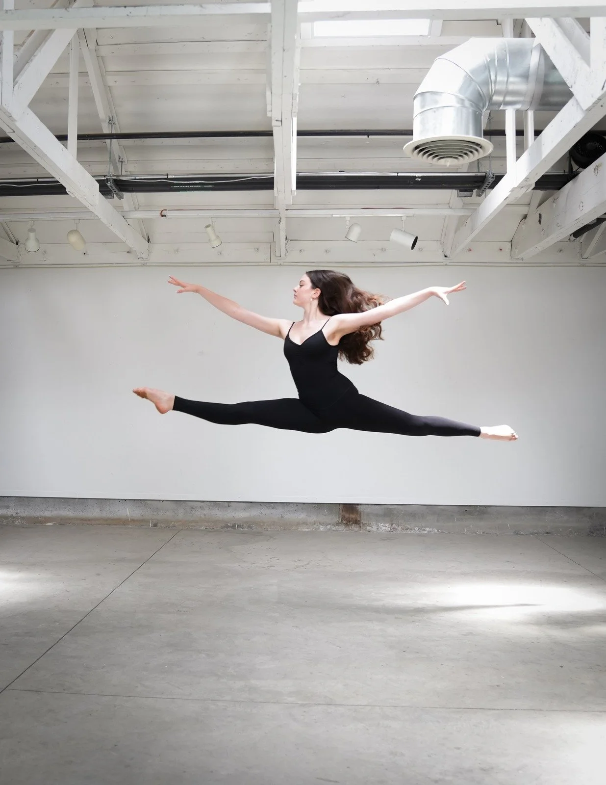 Dancer in a full split leap in the air.