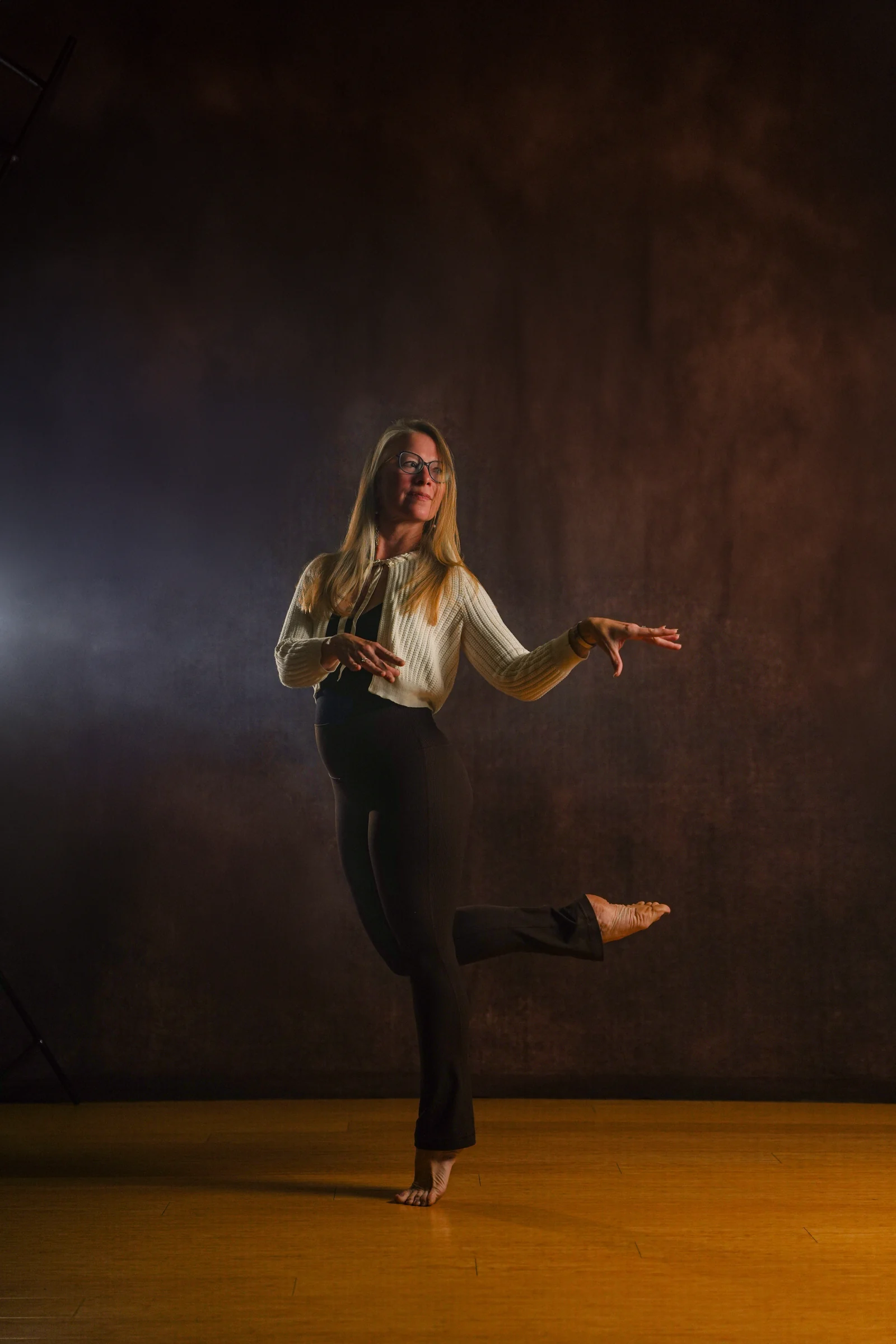Heather Wilder and another dancer leaping in a studio.