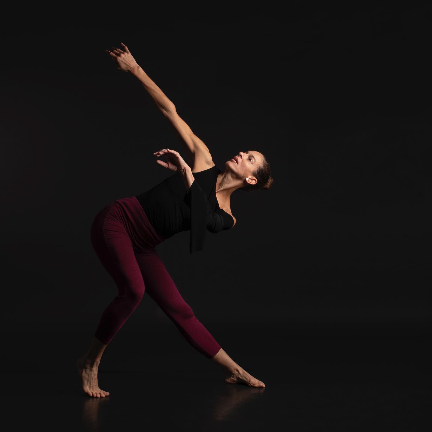 Micha Scott performing a modern dance pose.