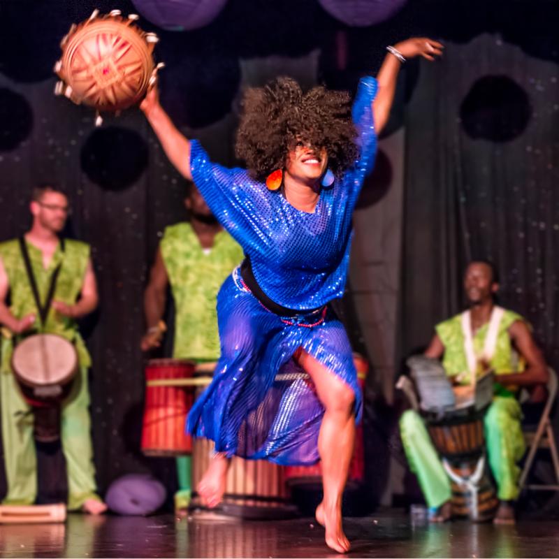 Oumou Faye performing with a calabash