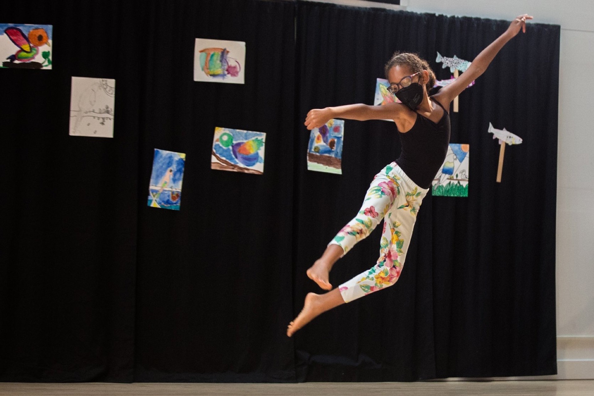 A SCOPEDance scholarship dancer leaping in the studio.